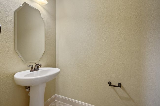 Bathroom featuring a textured wall | Image 10