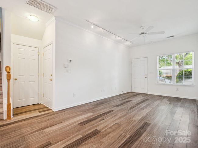 Large Family room. You can see the door to the garage. | Image 13