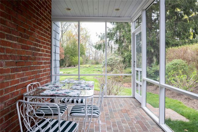 Screened porch for 3 season dining and views of back gardens | Image 8