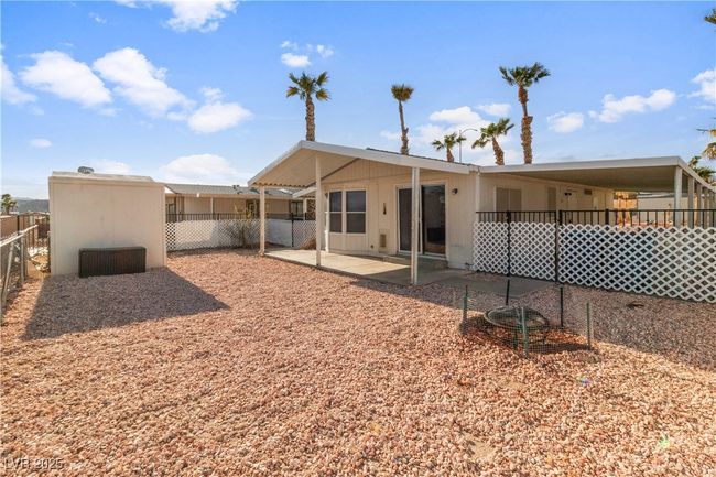 Rear view of house with fence and a patio | Image 39