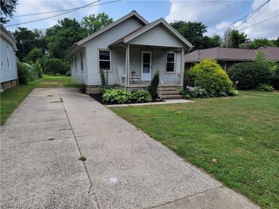 Bungalow-style house featuring a front lawn and covered porch | Image 2