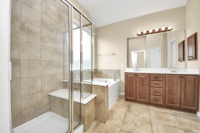 Primary bathroom with standing shower and soaking tub | Image 16