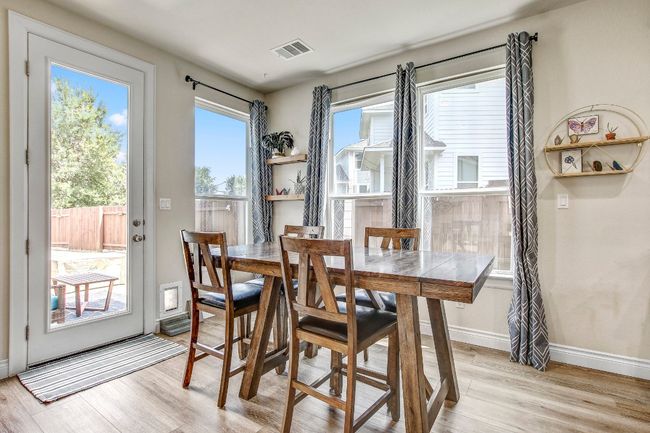 Dining room with light wood finished floors and baseboards | Image 13
