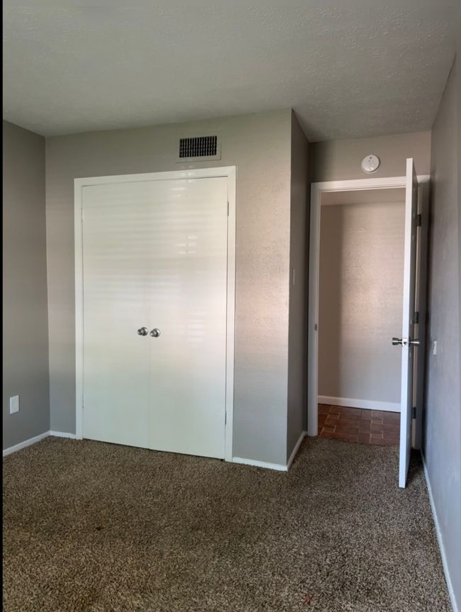 Unfurnished bedroom featuring carpet and baseboards | Image 14
