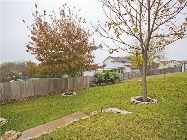 View of yard featuring a fenced backyard | Image 13