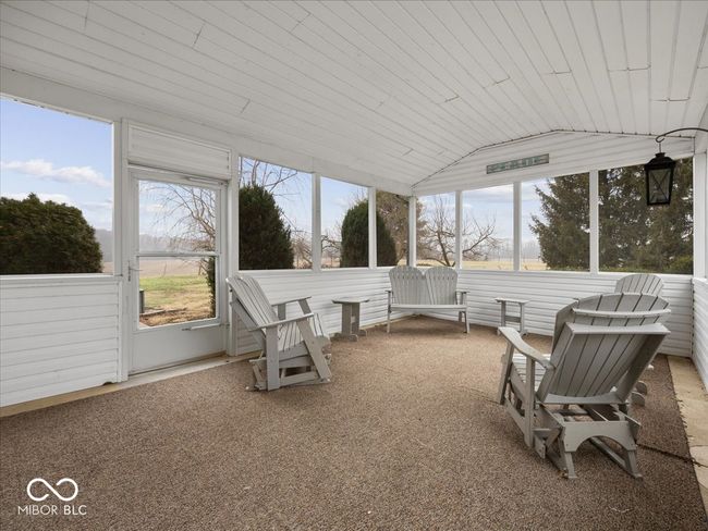 Screened in porch just off the dining room. | Image 14
