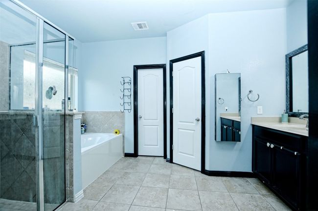 Separate tub and shower, double vanity, walk in closet | Image 16