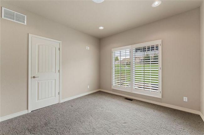 Carpeted spare room featuring visible vents, recessed lighting, and baseboards | Image 33