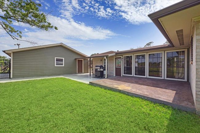 Sit and relax on the newly poured decorative concrete patio, watch the many variety of native birds such as cardinals, finches and sparrows that visit the property. Plan large gatherings and make memories with family and friends! | Image 33