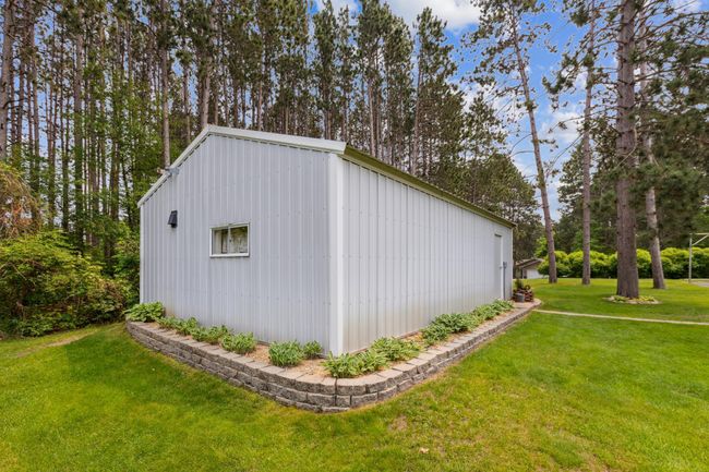 Nicely landscaped rear view of the pole building. | Image 39
