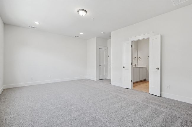 Unfurnished bedroom with light carpet and ensuite bath | Image 19