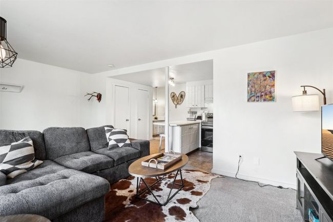 Living room with baseboards | Image 9