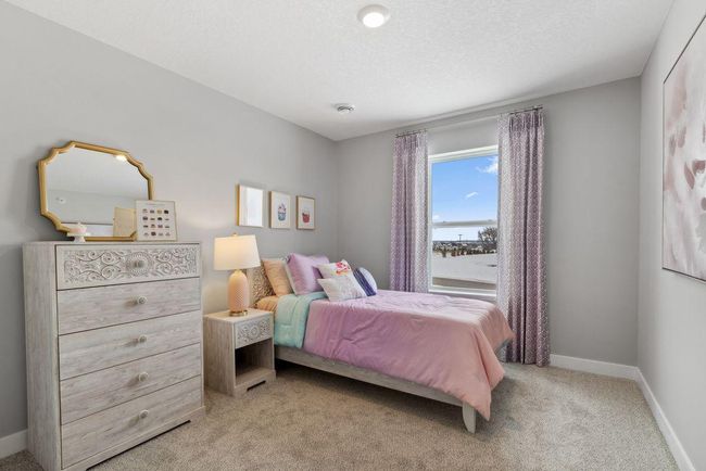 Spacious bedroom #3 with lots of natural light. Photo is of model home. Colors and options may vary. Ask Sales Agent for details. | Image 30