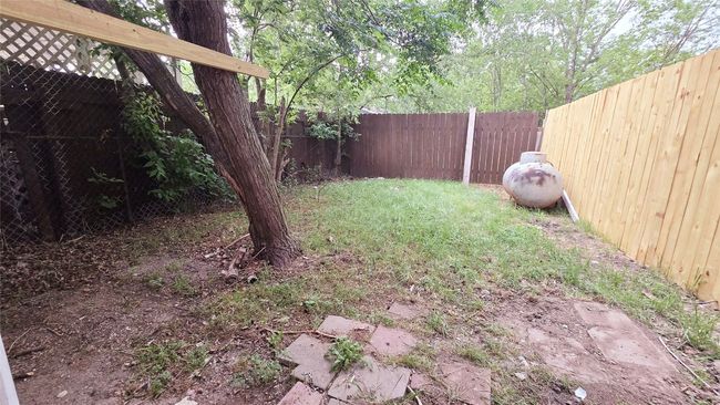 View of yard featuring a fenced backyard | Image 32