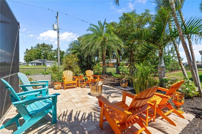 View of patio with a fenced backyard | Image 43