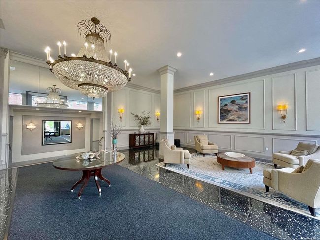 Community lobby with a decorative wall, ornamental molding, and recessed lighting | Image 23