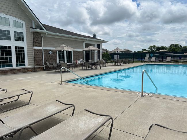 community pool featuring a patio area | Image 26
