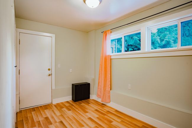 Spare room featuring light wood-type flooring and baseboards | Image 27