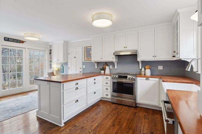 Sun filled space - eat in area with access to the lovely backyard. | Image 5