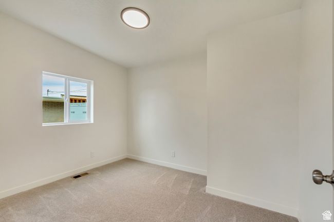 Empty room featuring visible vents, light carpet, and baseboards | Image 21