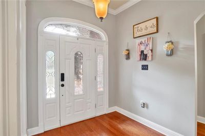 Foyer featuring hardwood / wood-style flooring and crown molding | Image 3