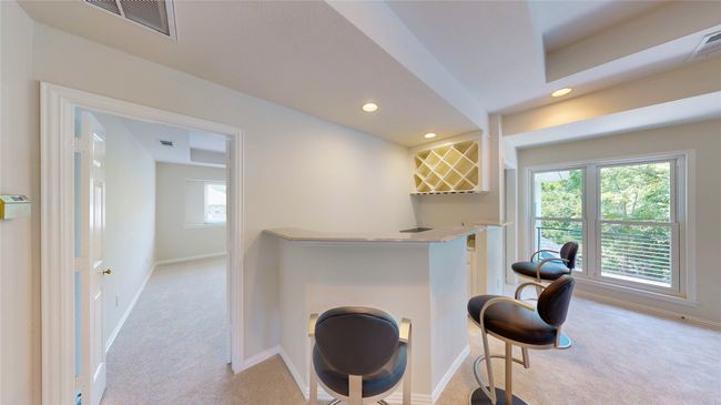 2nd floor wet bar with wine rack, extra storage and high-bar | Image 27