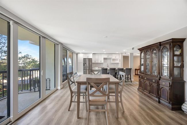 The dining area opens out to the a large balcony | Image 7
