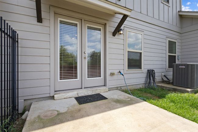 Doorway to property with a patio area, board and batten siding, and french doors | Image 30