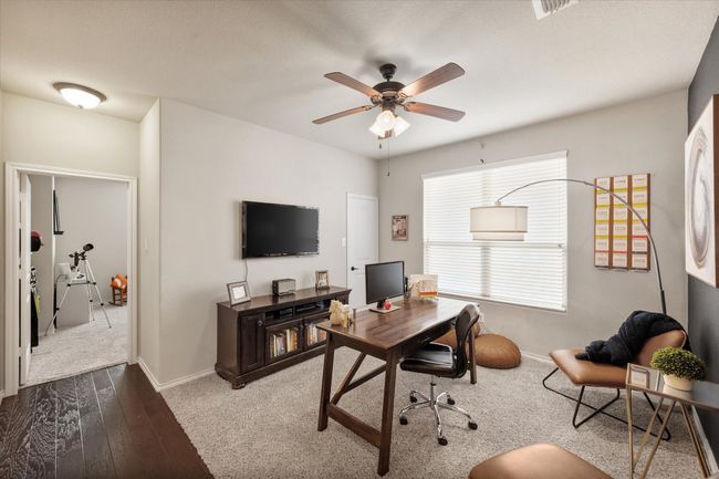 Office with visible vents, baseboards, a ceiling fan, and wood finished floors | Image 9