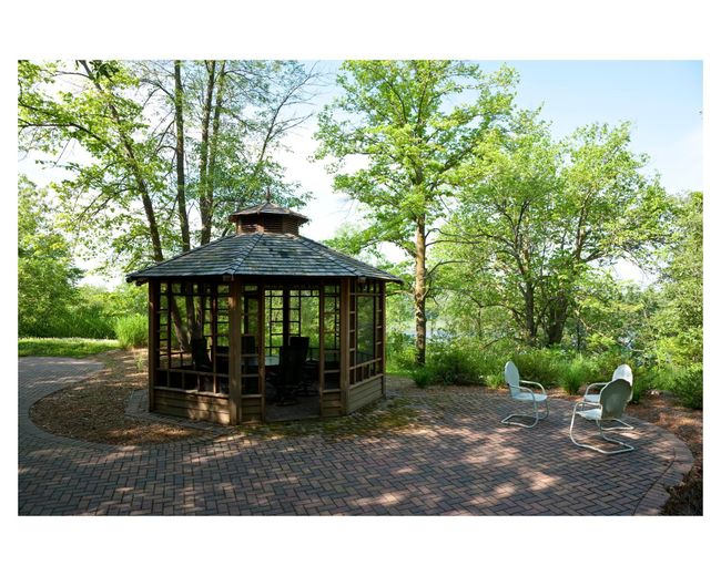 Enjoy the peaceful sights and sounds of nature while relaxing near the gazebo | Image 34