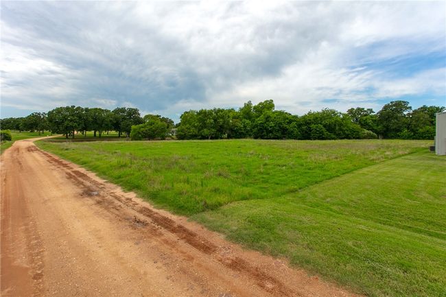 View of dirt / gravel road featuring a view of rural / pastoral area | Image 7