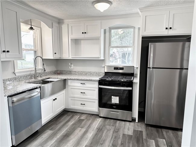 Kitchen with SS appliances | Image 5