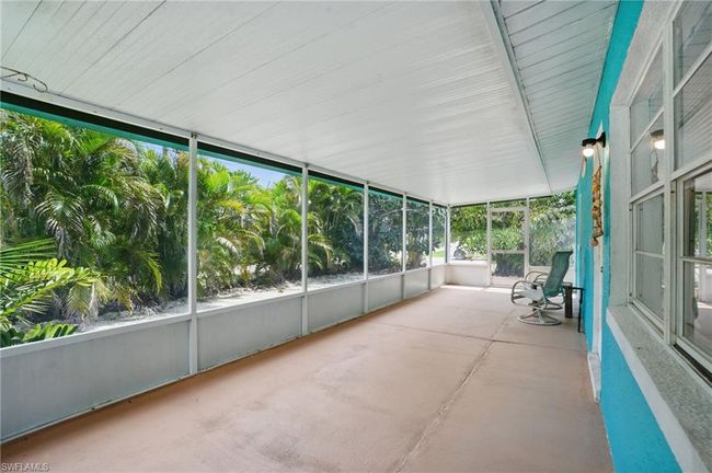 View of unfurnished sunroom | Image 13