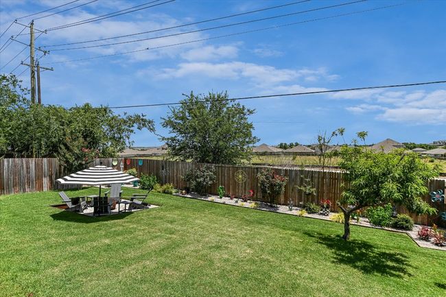 View of yard with a fire pit | Image 32