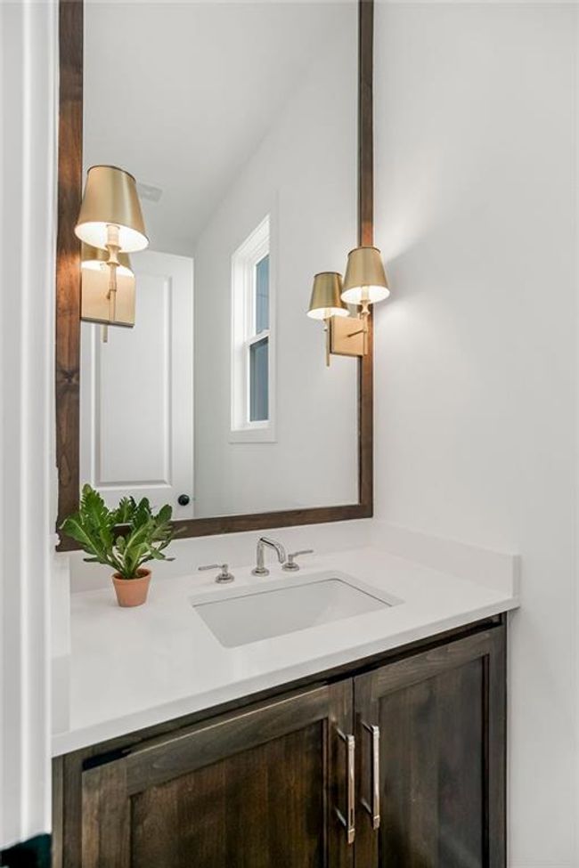 Main level half bath. Pictures are NOT of this home. Pictures are of a model home and may contain upgrades not included in the price of this home. | Image 22