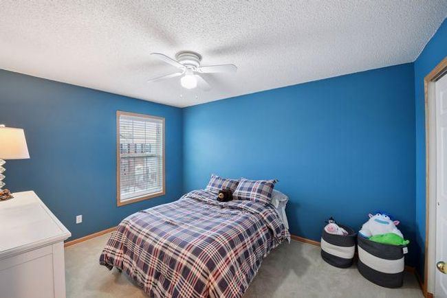 Bedroom 2 has a fan & large window. | Image 27