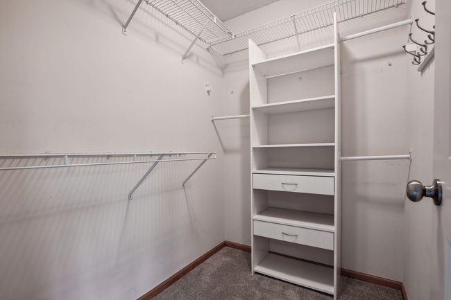 The 3/4 owner's bath has a stylish painted vanity | Image 17