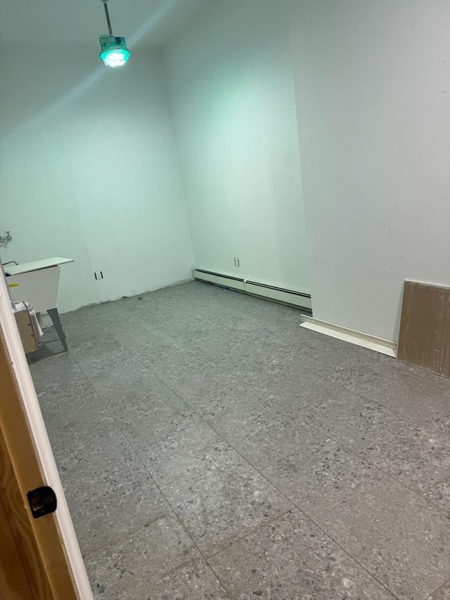 Empty room with baseboard heating | Image 7