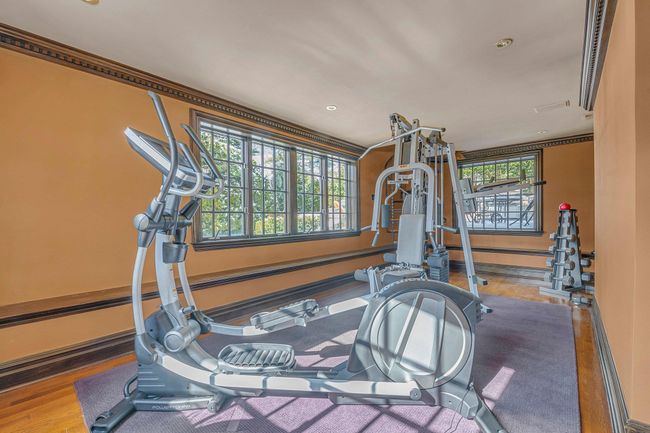 Basement Gym featuring baseboards, plenty of natural light, and recessed lighting | Image 22