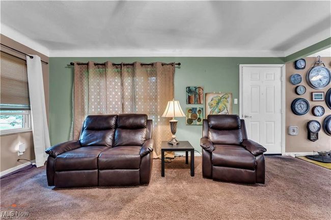 Carpeted living room with baseboards | Image 6