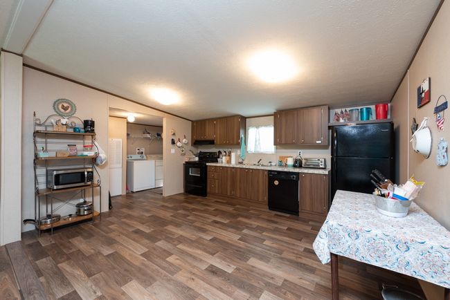 OPEN DINING AND KITCHEN AREA | Image 19