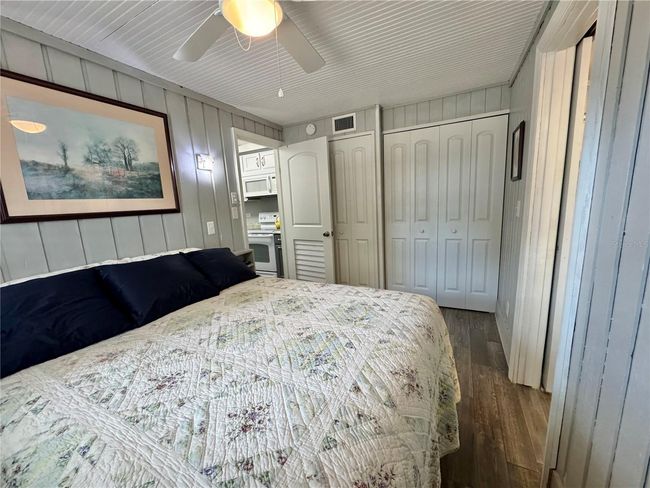 Primary bedroom off the kitchen. Built in closet and has a full primary bathroom with laundry closet | Image 16