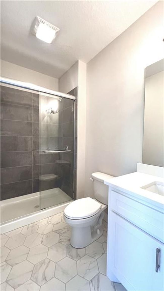 Lower-level bathroom. Note the classic octagonal tile! | Image 44