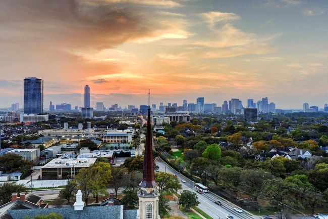 View from the covered terrace to the west, allowing for the ideal spot to watch the sun set. The unique perspective of the St. Lukes Church steeple with the landmark Williams Tower in the background is simply spectacular. | Image 24