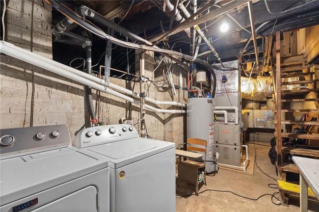Basement with washer/dryer and mechanicals. There is access from the outside to the basement for use as a storm shelter. | Image 24