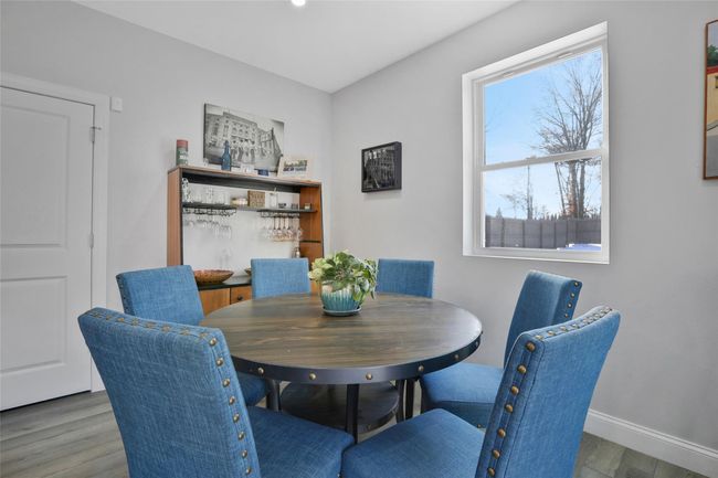 Dining room with dark hardwood / wood-style floors | Image 27