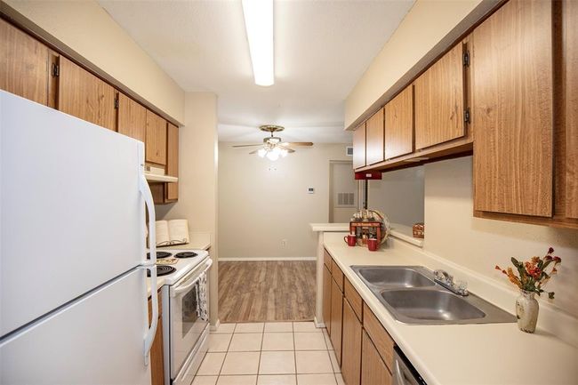 With its efficient layout and inviting design, this kitchen is both stylish and practical. | Image 19