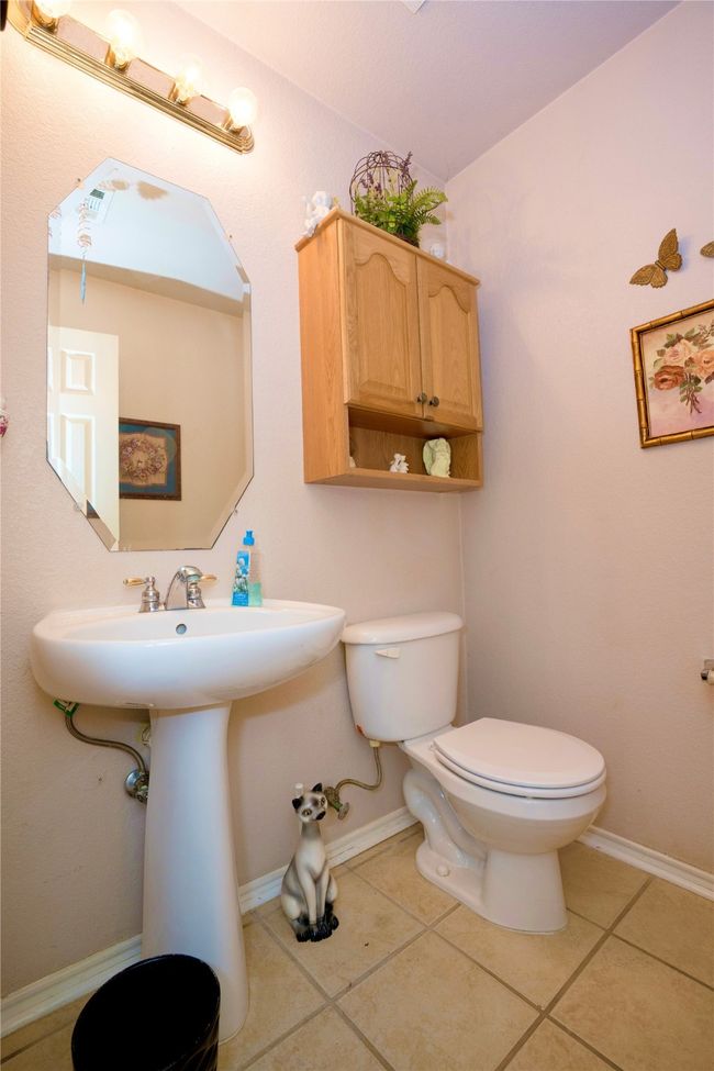 Half bathroom featuring tile patterned floors | Image 20
