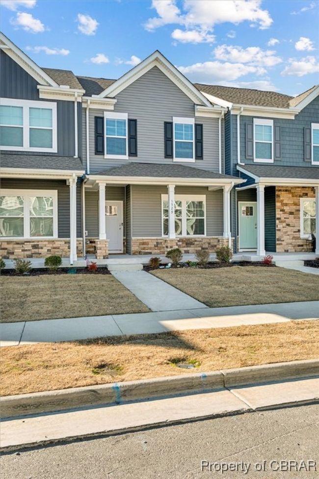View of front of property with stone siding and covered porch | Image 30