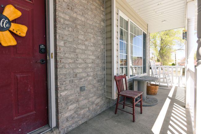 Exterior space featuring covered porch and brick siding | Image 5